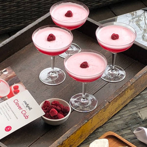 4 Clover clubs garnished with raspberries