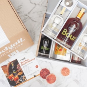 The Bourbon Old Fashioned Cocktail Box with the ingredients, recipe card and garnish.