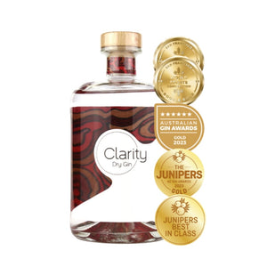 Clarity Dry Gin bottle with award badges
