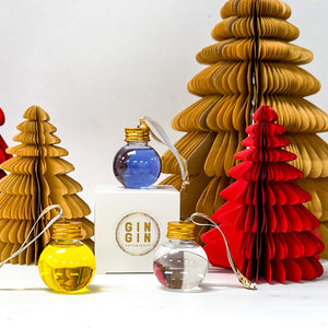 bright blue gin filled bauble, yellow gin filled bauble and clear gin filled bauble