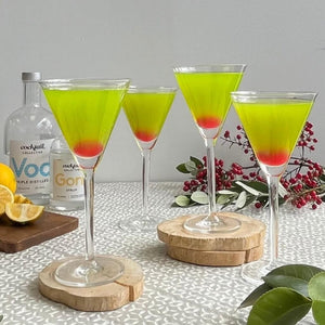 Japanese Slipper cocktails on a table with vodka and gomme