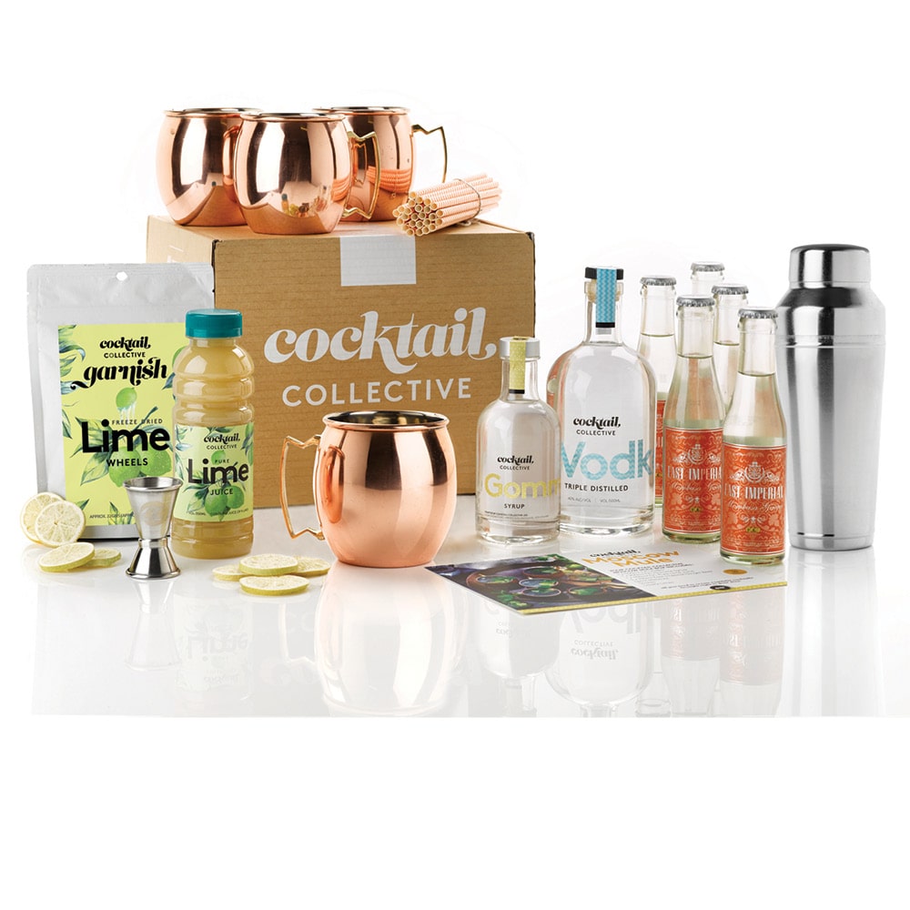 The Ultimate Moscow Mule Cocktail Kit with a Cocktail Collective gift box with Vodka, Gomme Syrup, Lime Garnish a silver Omaha shaker and set of 4 copper Moscow Mule mugs
