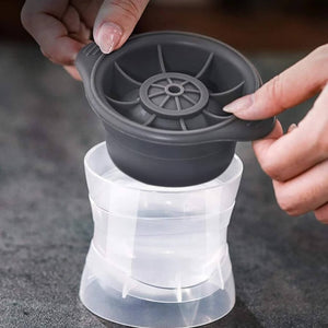 Female hands opening a ice ball mould