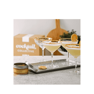 A tray of 3 delicious Margaritas in Schott Zwiesel cocktail coupes with Citrus Chili Salt rims by Cocktail Collective sitting on a kitchen bench