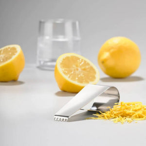 Zone Denmark Rocks Cocktail Garnish Peeler with fresh lemons