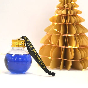Takapuna Butterfly Pea Gin bauble close up with christmas tree in background