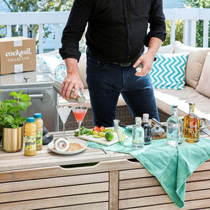 Man pouring cocktails on deck