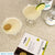 Two Gimlet cocktails with garnish, recipe card and ingredients