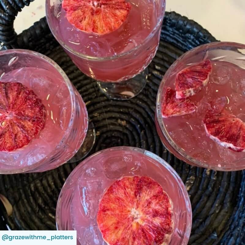 Beachcomber cocktails with blood orange garnish