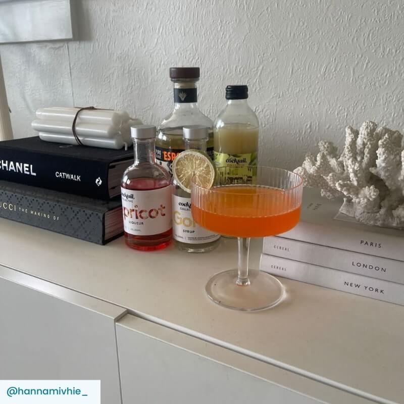 Toreador cocktail with garnish and ingredients on kitchen bench