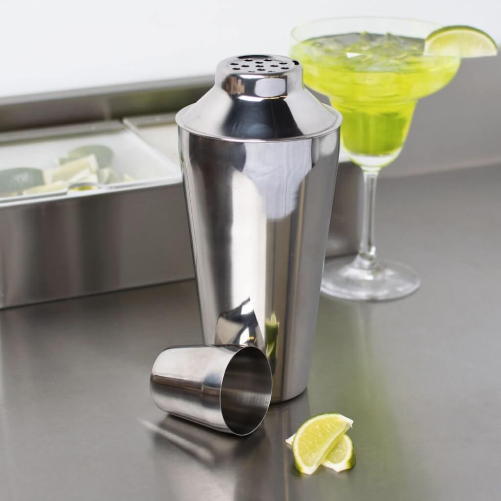 750ml Stainless Steel Shaker in front of a green cocktail with lime 