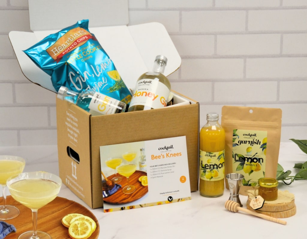The Bee's Knees cocktail box ingredients with drinks