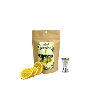 Ingredients for the deluxe lemon drop martini including freeze dried lemon wheels and a spirit measure 