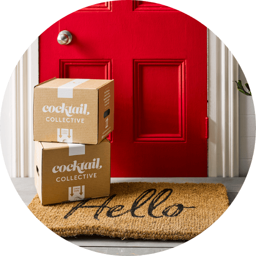 Cocktail Collective boxes delivered next to a red door with Hello mat