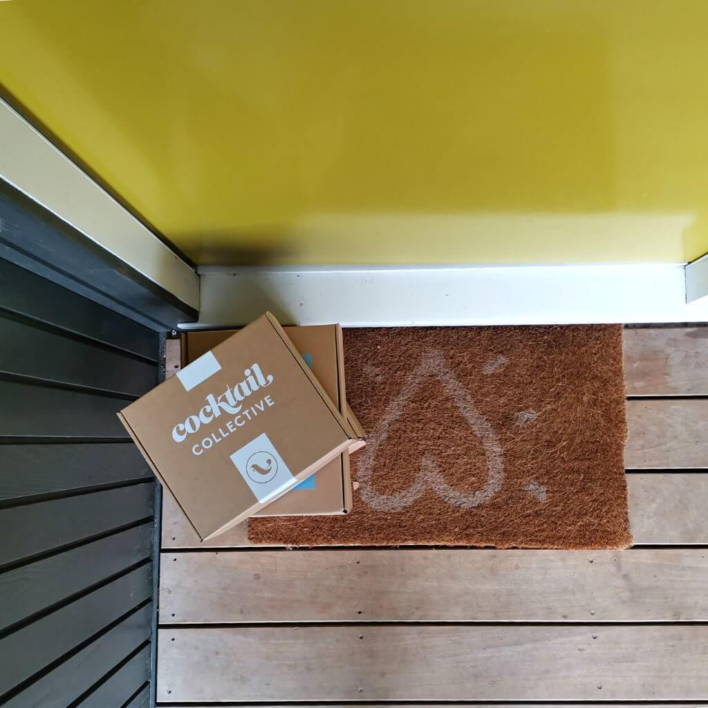 Cocktail Box delivery at yellow door