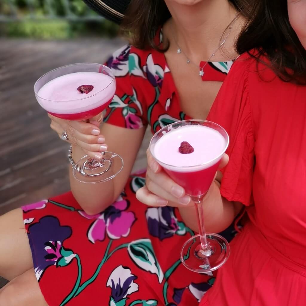 Clover Club cocktails held by women in summer