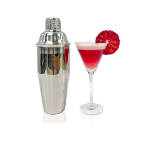 Stainless steel silver Cobbler Shaker standing next to a pink cocktail with a bright red blood orange garnish in an elegant long stemmed cocktail glass