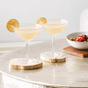 Bar Surf Coupe Glasses with Gin Gimlets and Lime Wheel Garnish