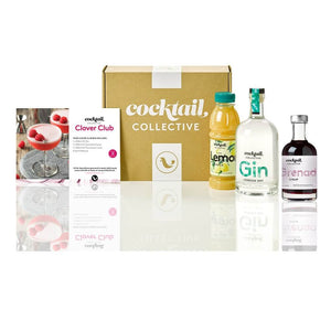 The Clover Club cocktail kit with a bottle of Gin, Grenadine syrup, Lemon Juice & recipe card displayed in front of a Cocktail Collective box
