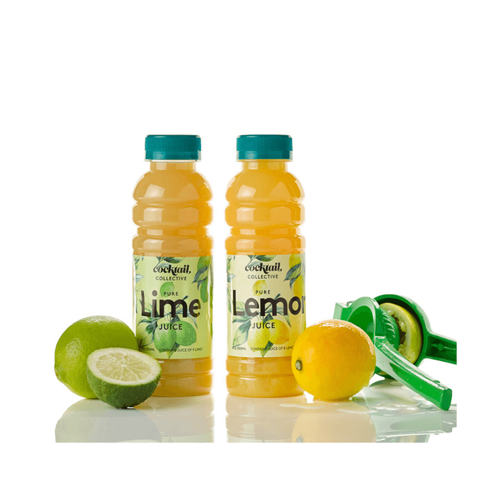 A duo of juices with a 350ml bottle of Pure Lemon & Pure Lime Juice next to freshly squeezed lemon and fresh cut lime | Cocktail Collective