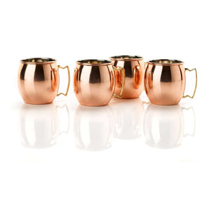A set of four traditional copper mule mugs with gold handles from Cocktail Collective