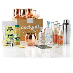 The Ultimate Moscow Mule Cocktail Kit with a Cocktail Collective gift box with Vodka, Gomme Syrup, Lime Garnish a silver Omaha shaker and set of 4 copper Moscow Mule mugs