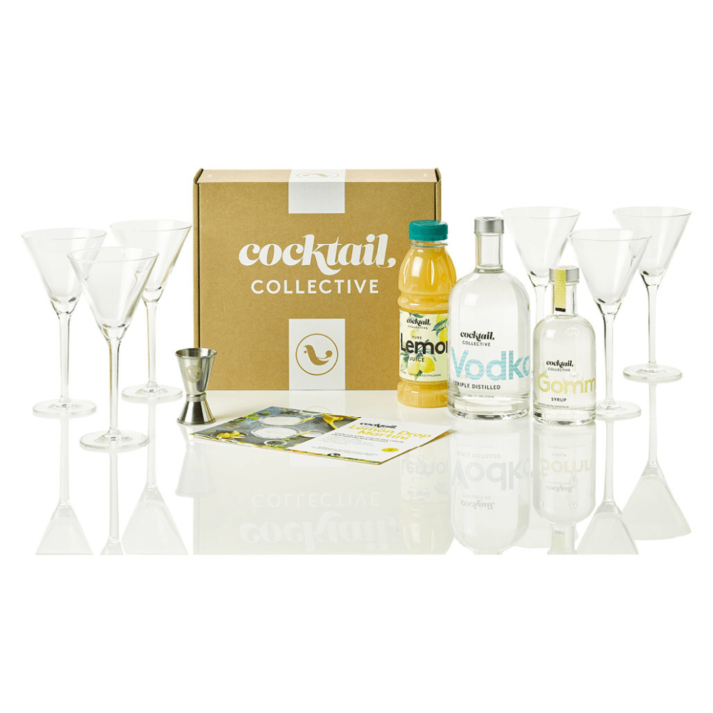 The Lemon Drop Martini Cocktail Kit featuring Vodka, Gomme Syrup, Pure Lemon Juice, a recipe card and 6 Schott Zwiesel long stemmed Martini glasses with a gift box