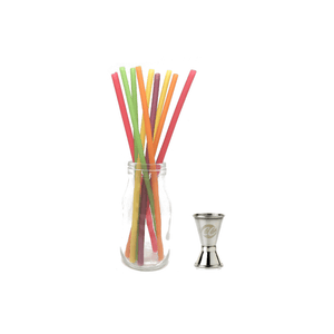 10 colourful Raw Straws standing in a bottle next to a double sided spirit measure from Cocktail Collective