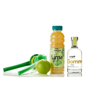 350ml bottle of Lime juice & 200mls of Gomme Syrup next to a fresh lime & lemon press | Cocktail Collective
