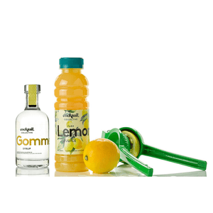 Cocktail Collective Gomme Syrup and Pure Lemon Juice with a lemon and a lemon squeezer