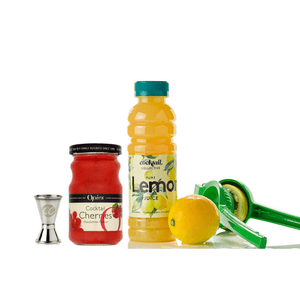 A 350ml bottle of Cocktail Collective lemon juice with a lemon squeezer, a jar of cherries and a spirit measure