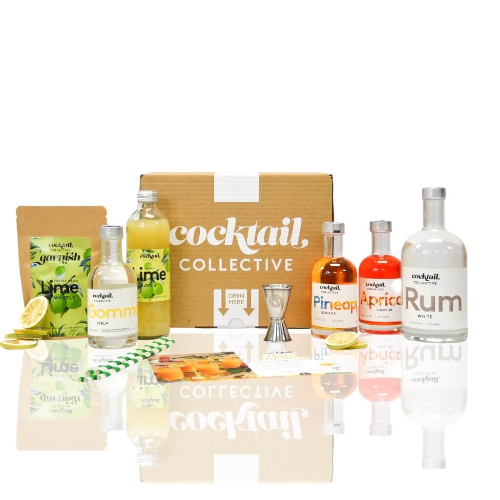 Tray of Hotel Nacional cocktails with lime wheel garnish